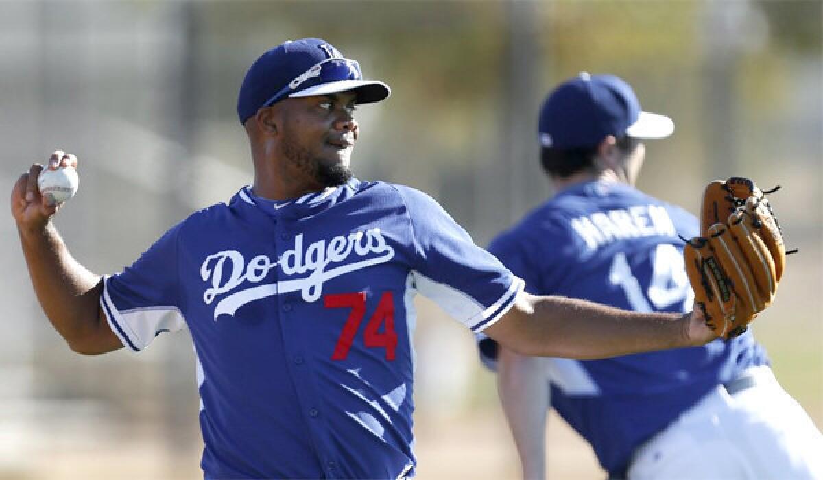 Kenley Jansen throws during a practice Tuesday at the Dodgers' Spring Training home in Glendale, Ariz.