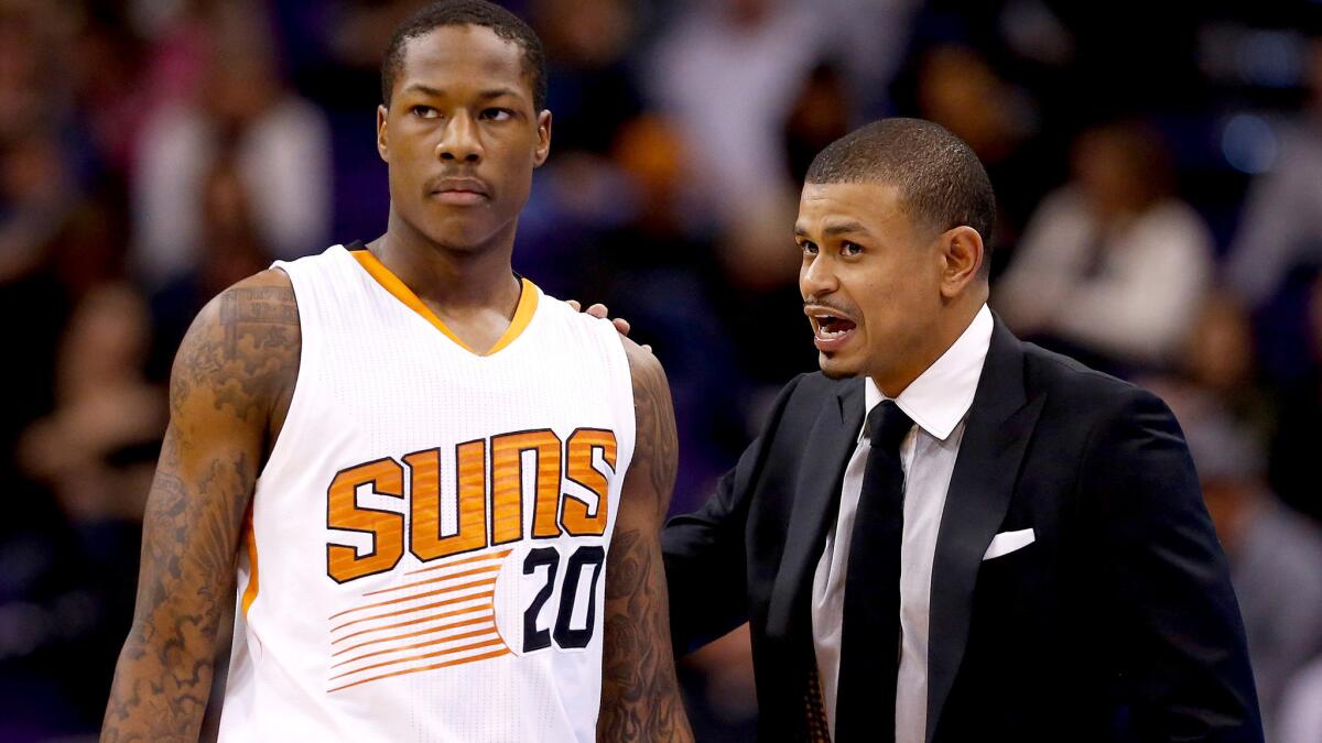 Interim Coach Earl Watson talks to Suns guard Archie Goodwin during a game against the Raptors on Feb. 2.