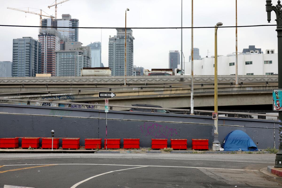 Planters line West 18th Street in Los Angeles to discourage homeless people from camping there.