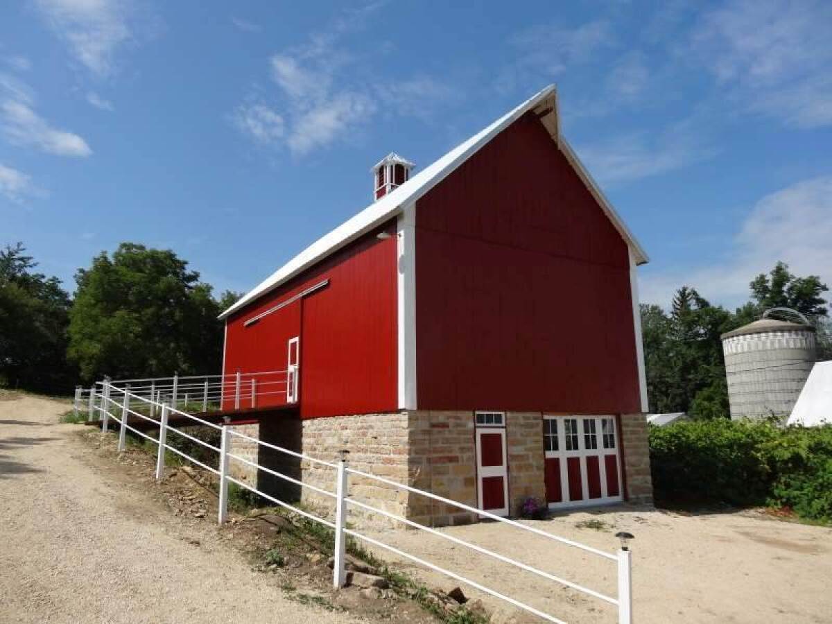 Kolsrud barn, Waukon, Iowa Jacob Jacobson, arrived in Iowa from Norway in 1862 ,bought 80 acres for $500, and built the barn using timber and rock from the farm. Grant Kolsrud, fifth generation, used 150 gallons of paint when he recently restored the barn. Photo by Duane Fenstermann