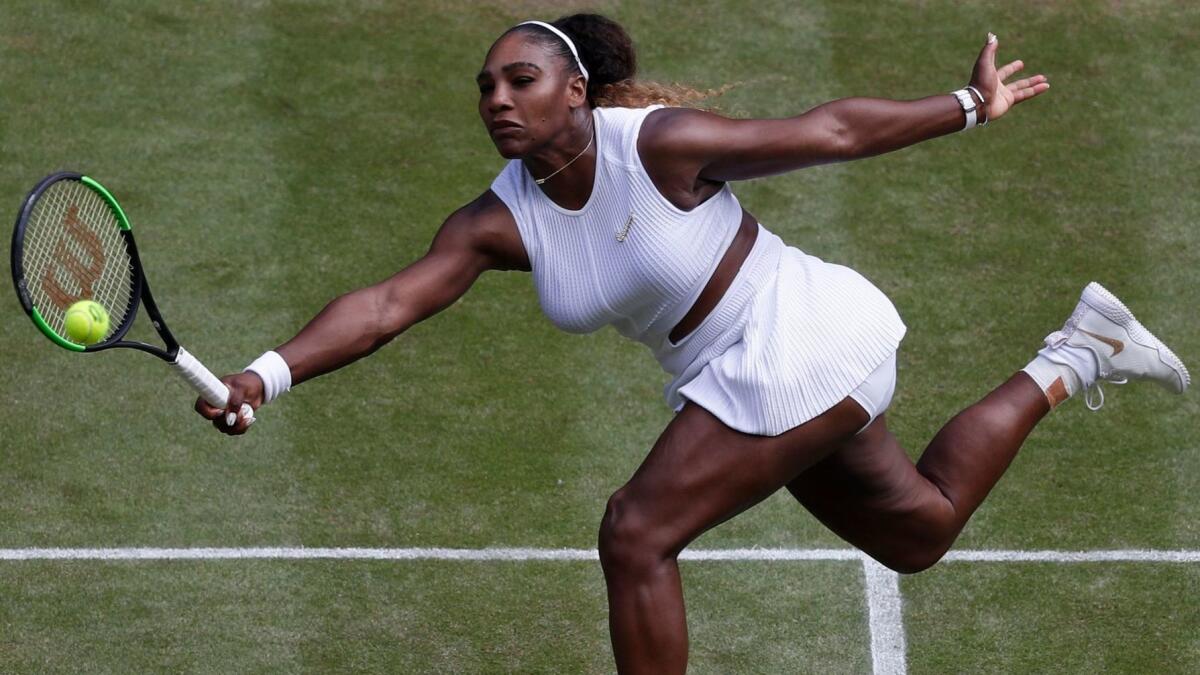 Serena Williams hits a return during a match at Wimbledon in July.