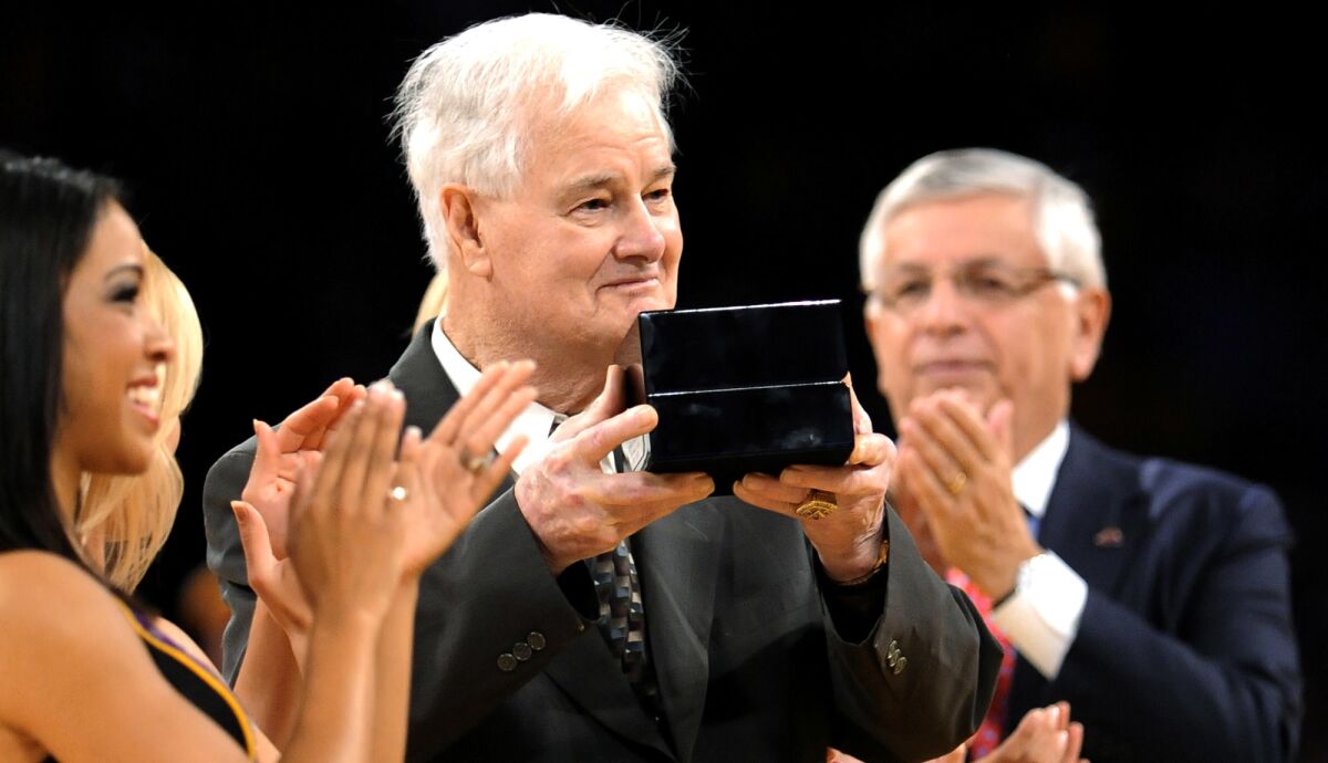 Then-Lakers assistant coach Tex Winter receives his 2009 NBA championship ring during a ceremony at Staples Center on Oct. 27, 2009.