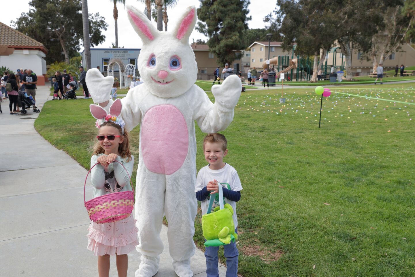 Karinna Miholich and Joseph Slack visit with the Easter Bunny
