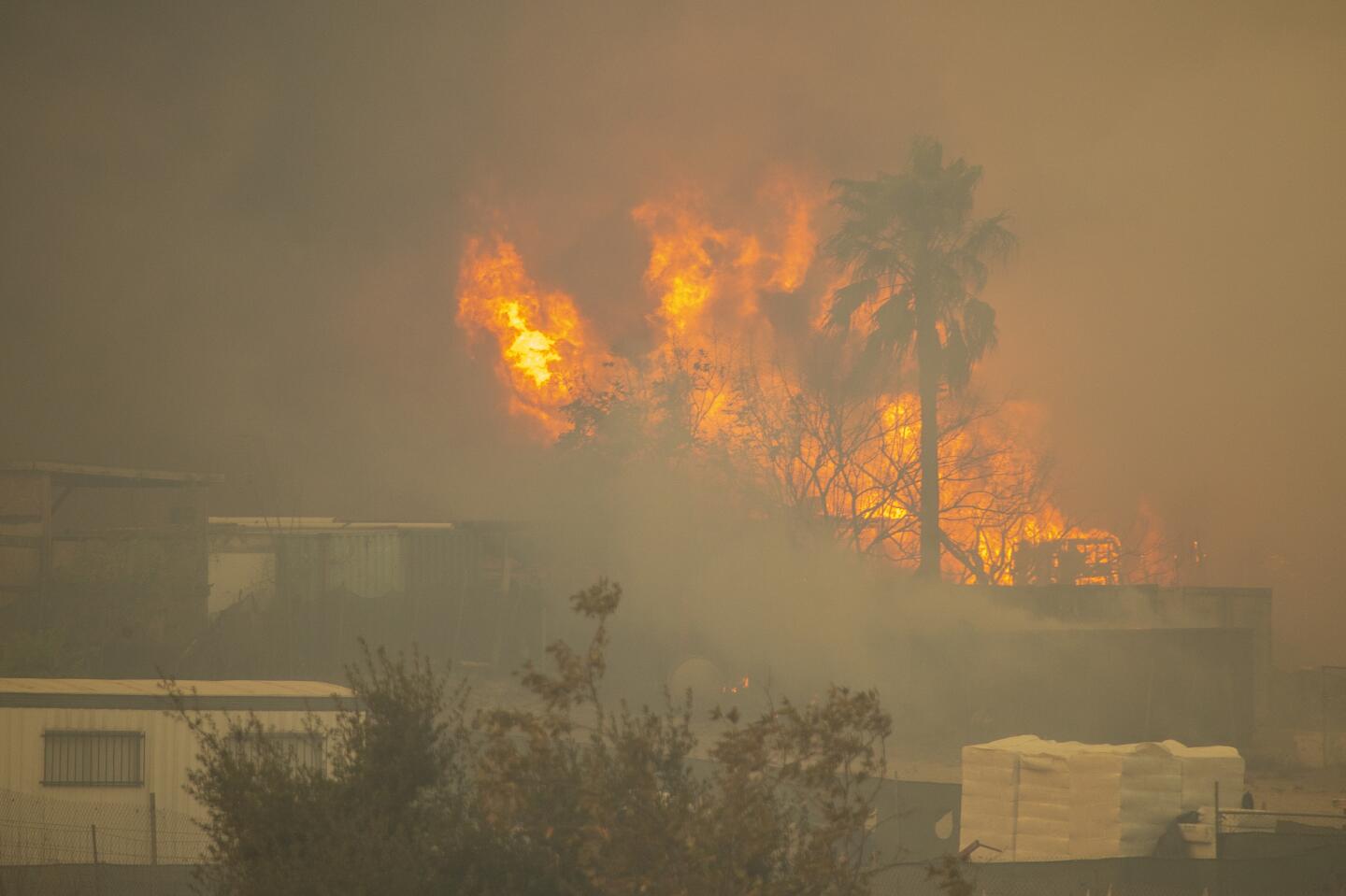 Fire burns amid a smoky haze