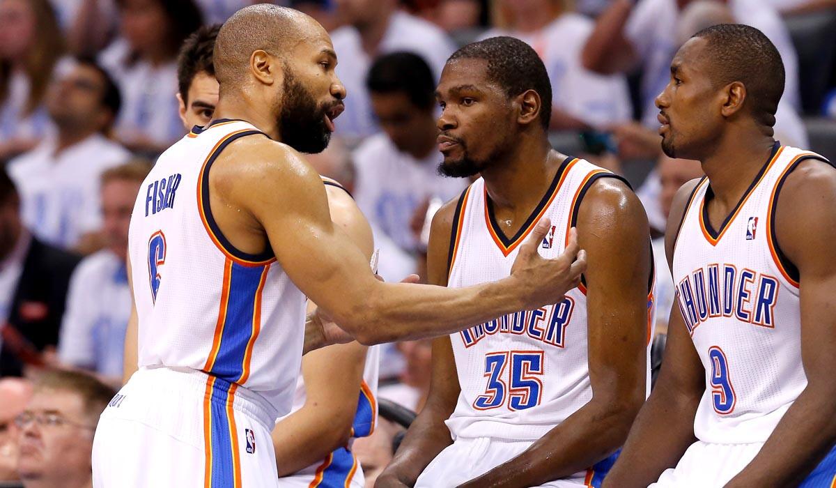 Thunder reserve guard Derek Fisher (6) talks to All-Star forward Kevin Durant (35) and power forward Serge Ibaka (9) during a break in play in Game 6 of the Western Conference finals on Saturday night in Oklahoma City.