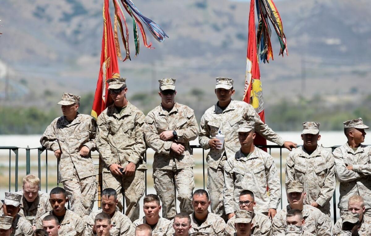 Lawmakers want to ask California voters to change the way the $900 million in Proposition 12 money is used to help veterans find homes. Above, members of the Marines Corps. wait at Camp Pendleton in August.