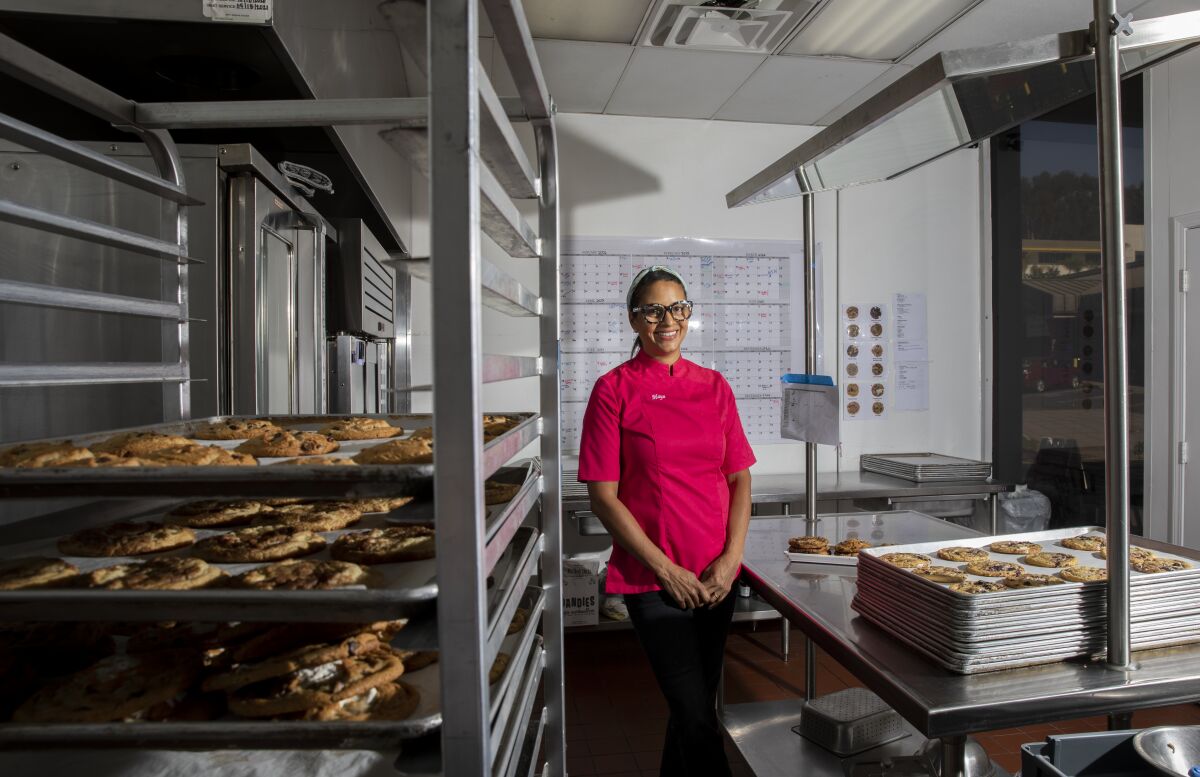  Maya Madsen, owner of Maya's Cookies, in her bakery's kitchen.