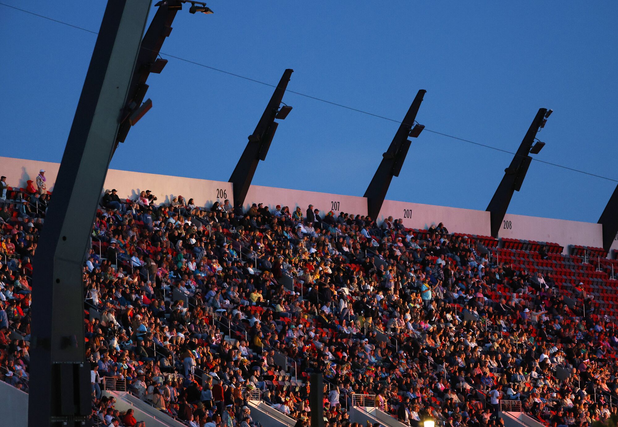 Fans watch as Jason Mraz performs at Snapdragon Stadium.