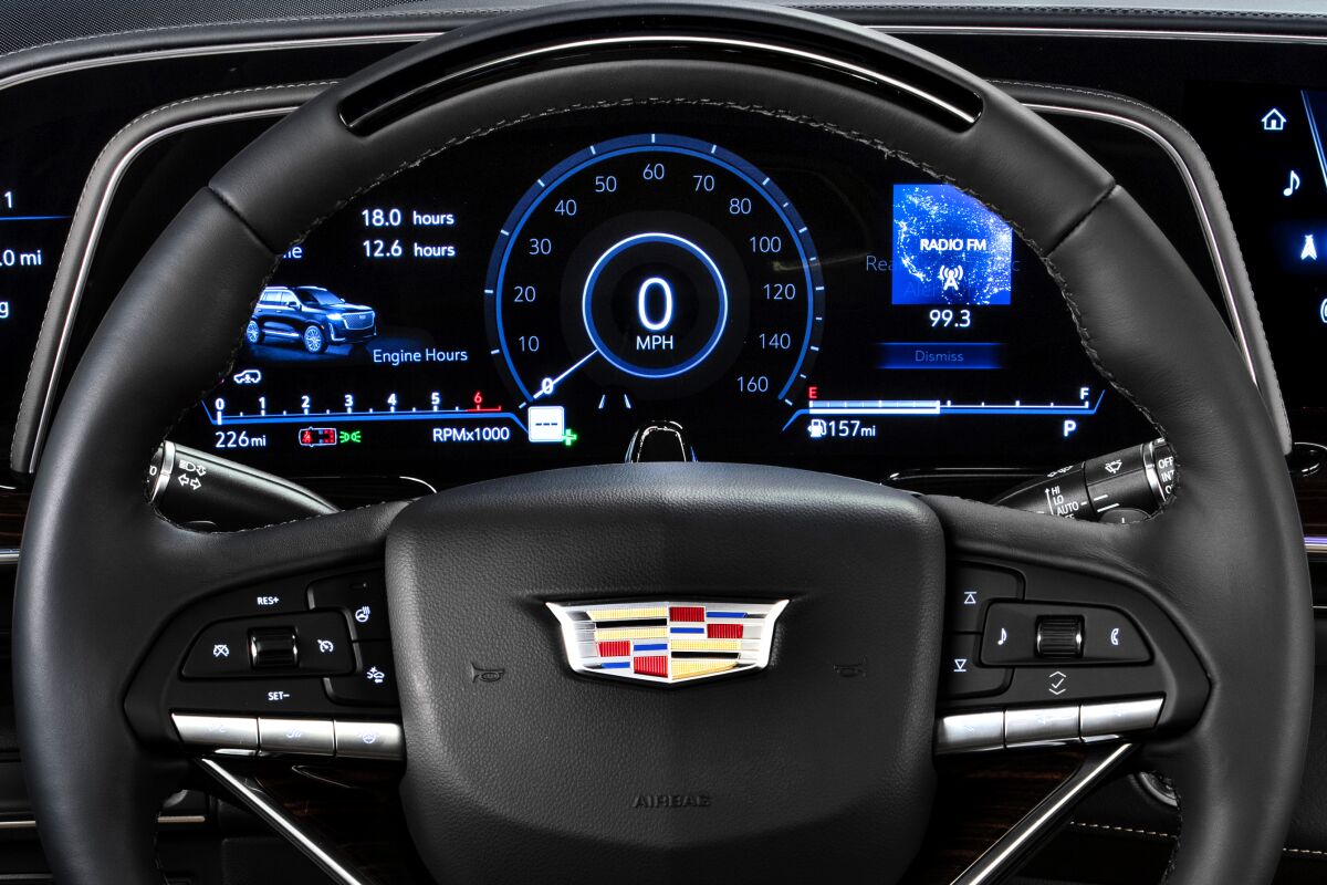 A 2021 Cadillac Escalade steering wheel with a gumdrop-shaped monitoring camera 