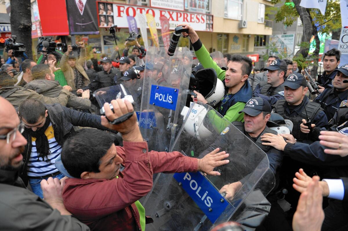 Police use pepper spray on demonstrators in Ankara, Turkey, during a protest against the arrest of two journalists at the newspaper Cumhuriyet on spying charges. The paper had reported that Turkey’s intelligence agency had covertly sent weapons to Islamist rebels in Syria.