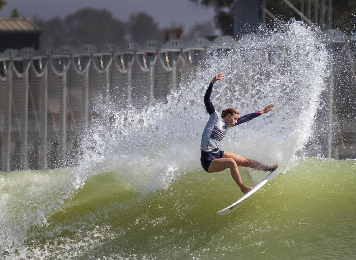 Bianca Buitendag, of South Africa, who is competing on the World Team, does a slashing turn on top of a machine-sculpted left.