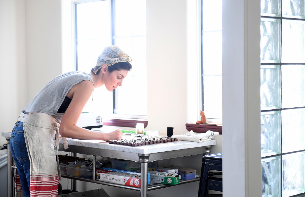 Vanessa Lavorato, founder of Marigold Sweets, is a chocolatier who makes fleur de sel caramels and vegan matcha coconut caramels in her kitchen at home in Mount Washington.