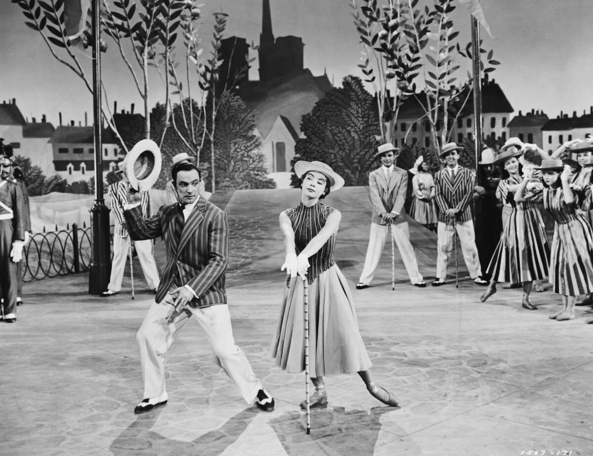 Gene Kelly dances with Leslie Caron in “An American in Paris” (1951)