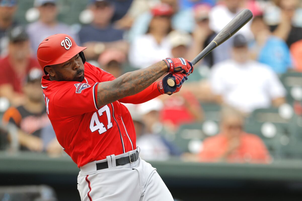 Washington Nationals designated hitter Howie Kendrick swings at a pitch during an exhibition game.