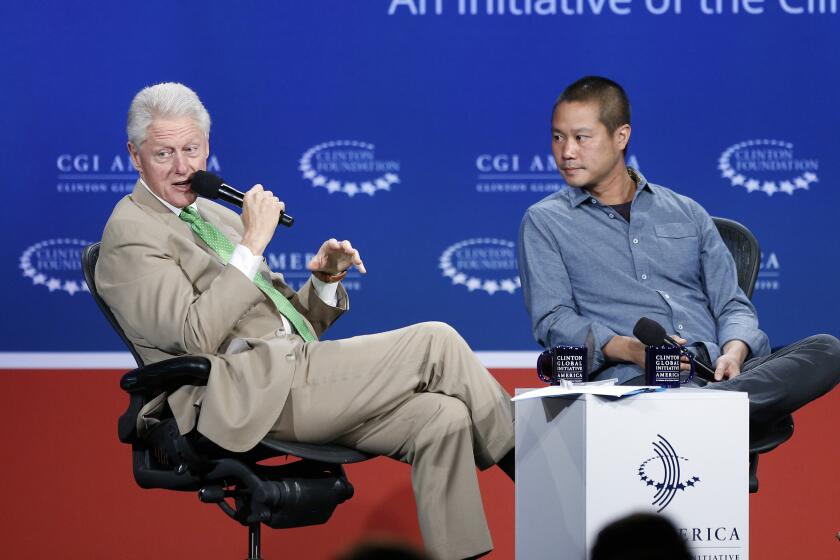 President Bill Clinton speaks with Zappos.com CEO Tony Hsieh 