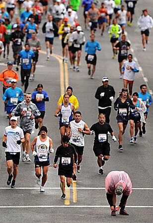 A competitor ties his shoe