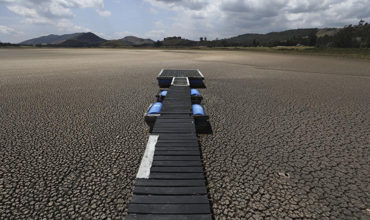 Floating dock atop dried-up lakebed in Colombia