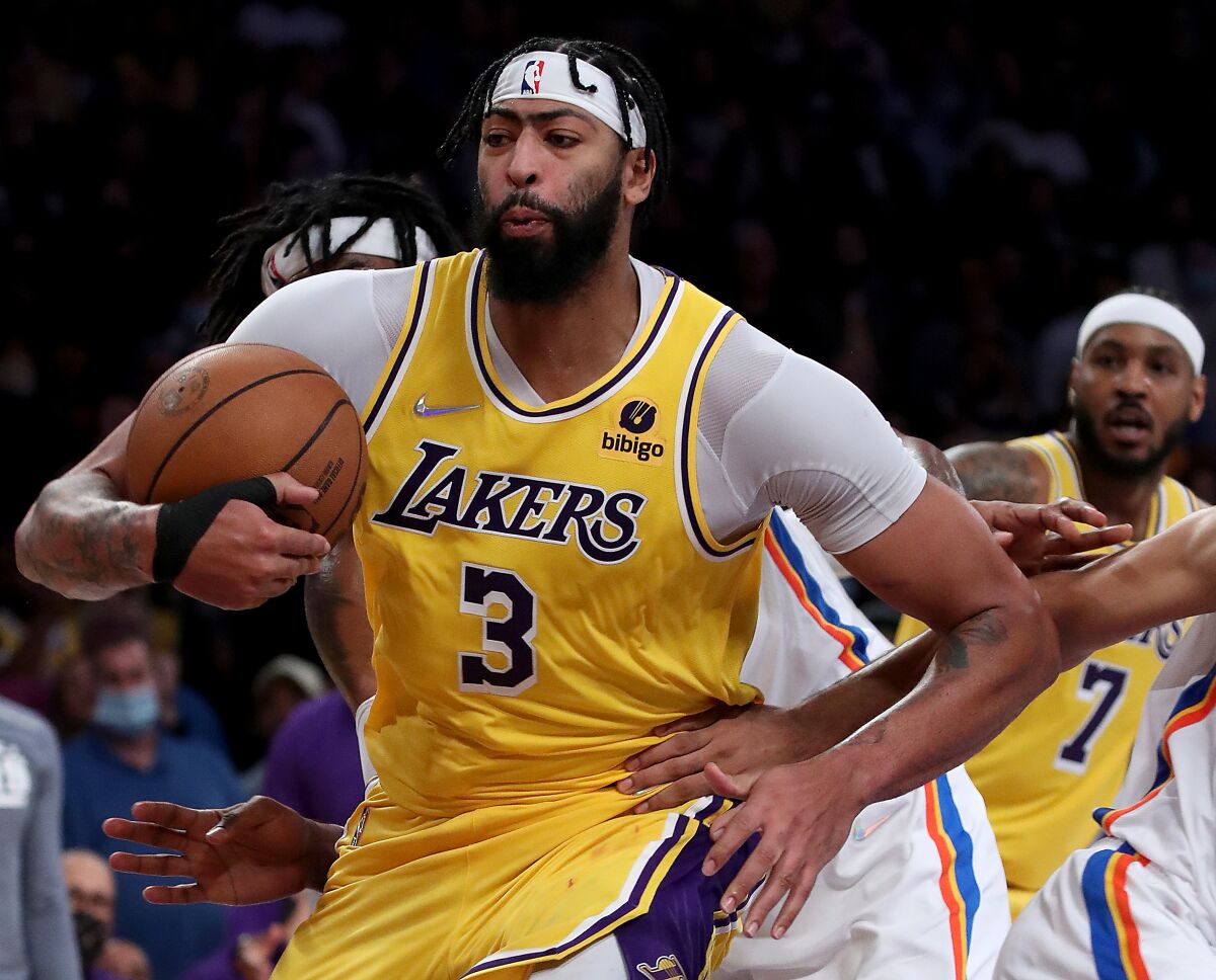 Lakers' Anthony Davis pulls down a defensive rebound against the Oklahoma City Thunder.