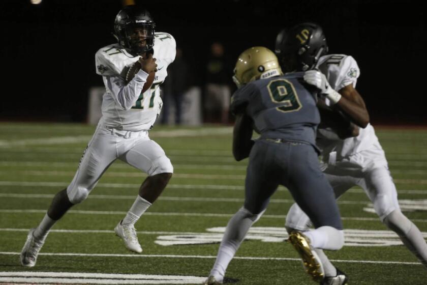 Junior quarterback Jalen Chatman of Narbonne scrambling.