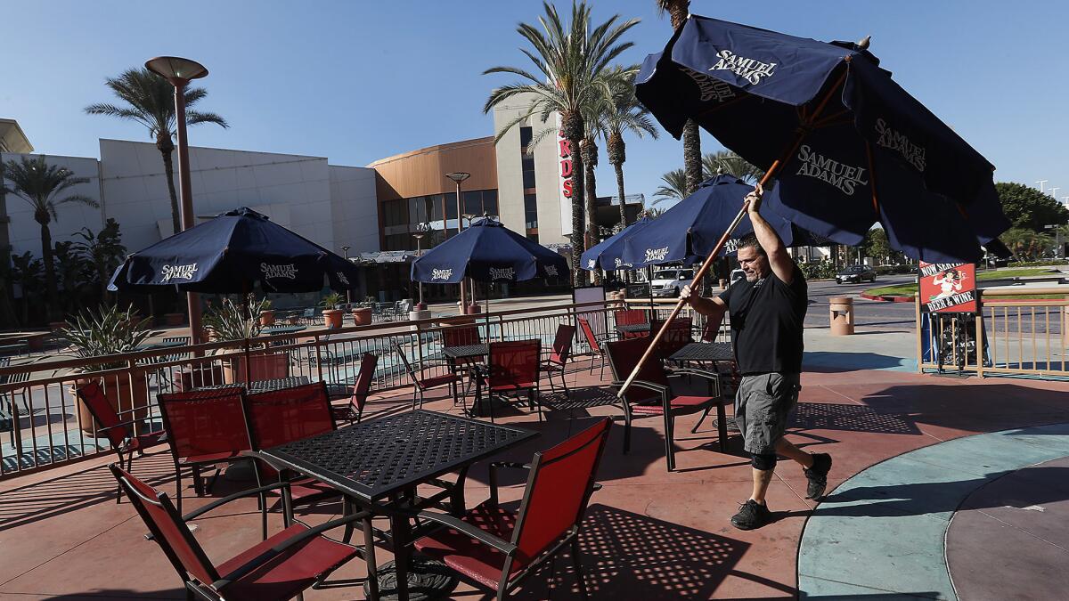 Mario Mancuso, owner of Anna's Pizza, in the Lakes Entertainment Center, prepares for the lunch crowd.