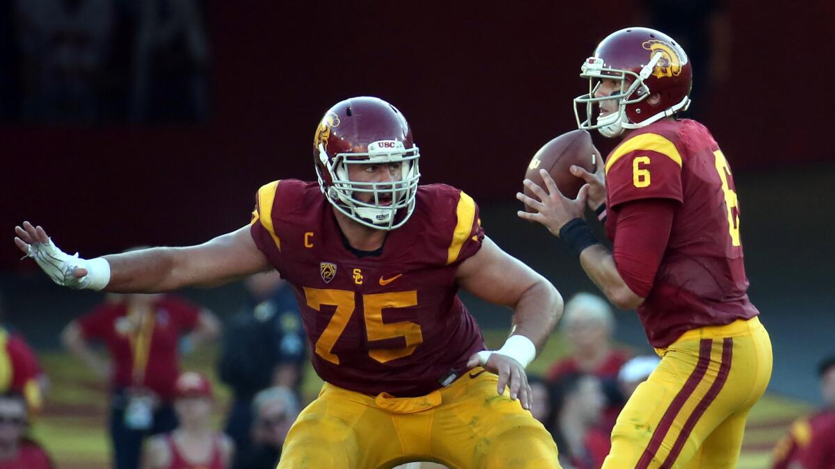 Offensive lineman Max Tuerk (75) and quarterback Cody Kessler, shown in action against Stanford on Sept. 19, 2015, are two of seven Trojans invited to participate in the NFL scouting combine.