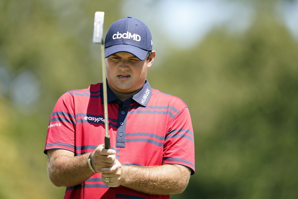 Patrick Reed lines up his putt on the second green during the third round of the Tour Championship golf tournament Saturday, Sept. 4, 2021, at East Lake Golf Club in Atlanta. (AP Photo/Brynn Anderson)