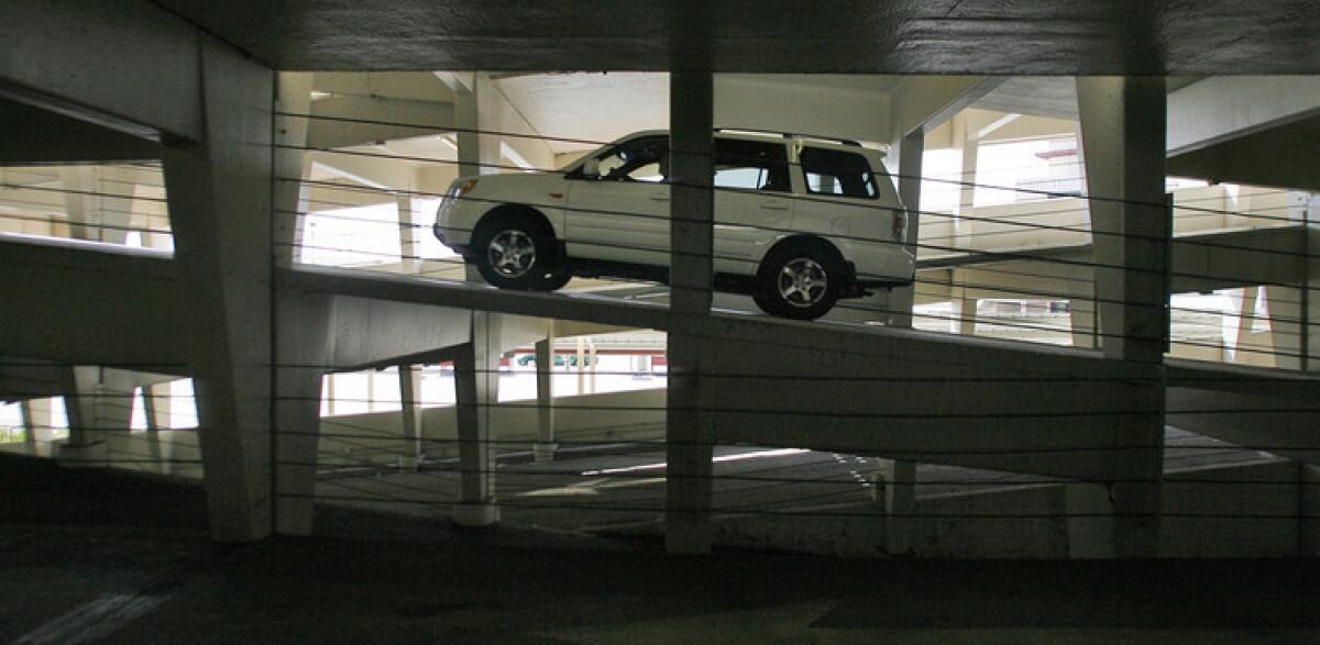 An SUV climbs the ramp at the Bob Hope Airport parking garage, where day rates will rise to $31.