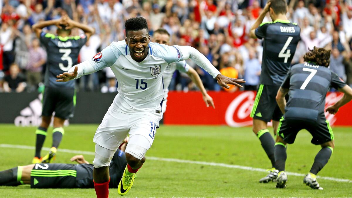 Daniel Sturridge (15) begins to celebrate after scoring England¿s second goal against Wales in a Euro 2016 Group B game on Thursday.