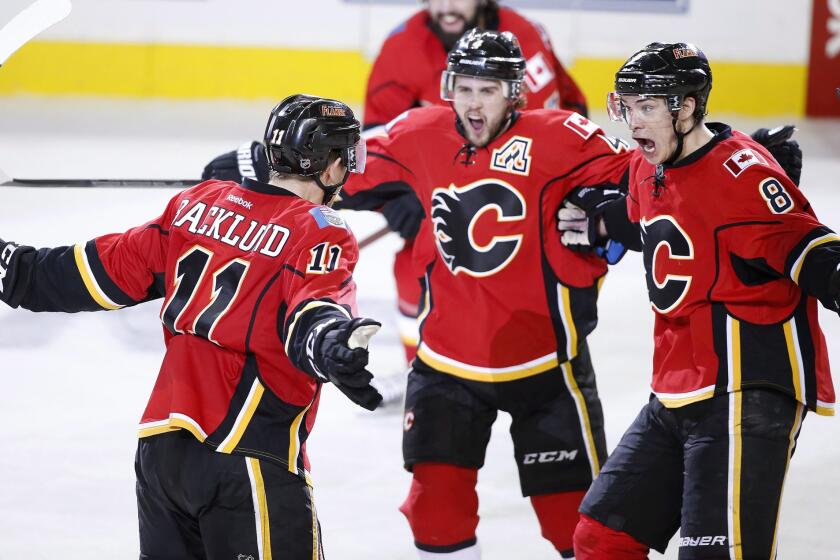 Calgary forward Mikael Backlund celebrates his game-winning goal in overtime to give the Flames a 4-3 victory Tuesday over the Ducks in Game 3 of their Western Conference semifinal playoff series.