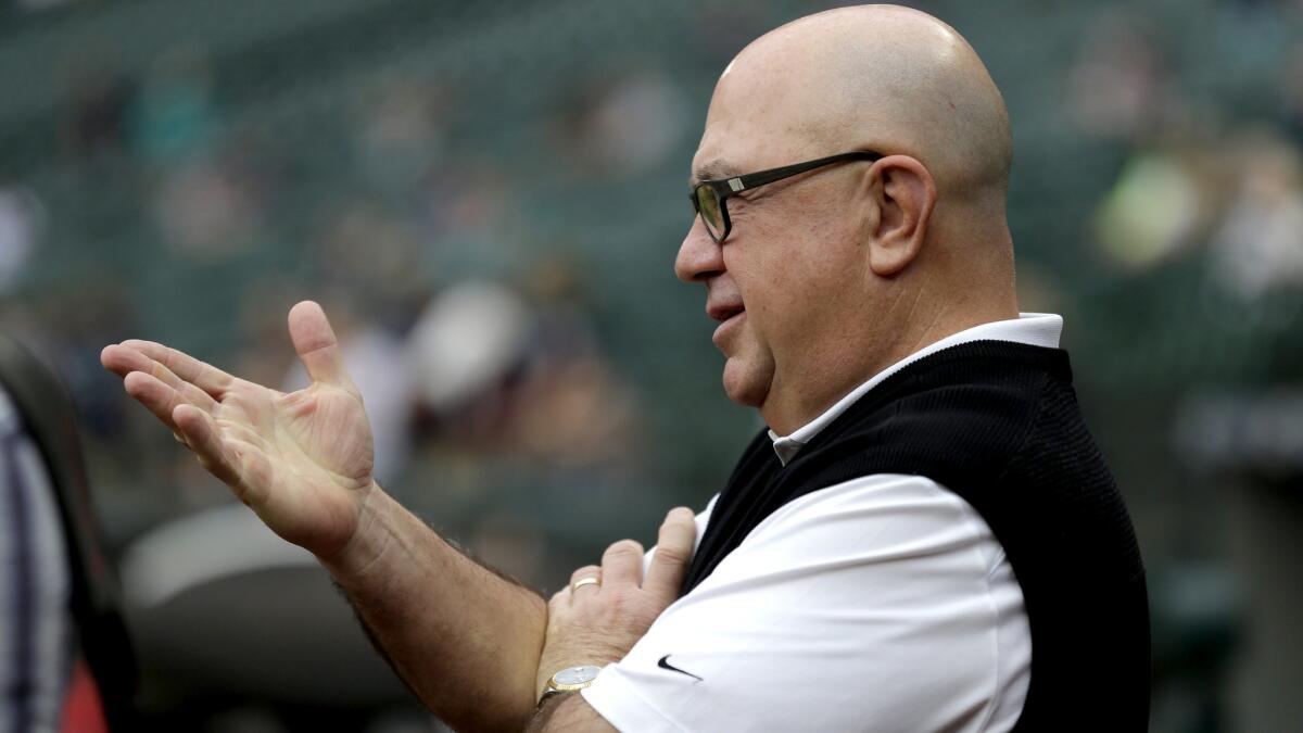 Jack Zduriencik watches the Mariners take batting practice before a game against the Angels on July 10 in Seattle.