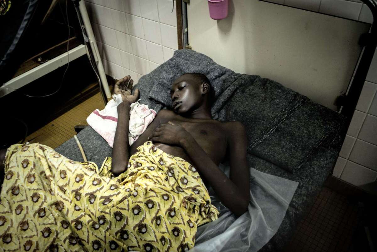 A wounded boy rests in hospital after rebels stormed a church compound where hundreds of civilians had sought refuge in the Central African Republic capital, Bangui, on May 28.