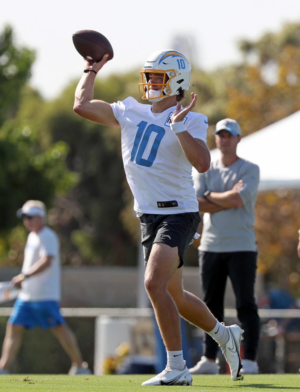 Quarterback Justin Herbert throws the ball during Chargers training camp on Wednesday at Jack Hammett Sports Complex.