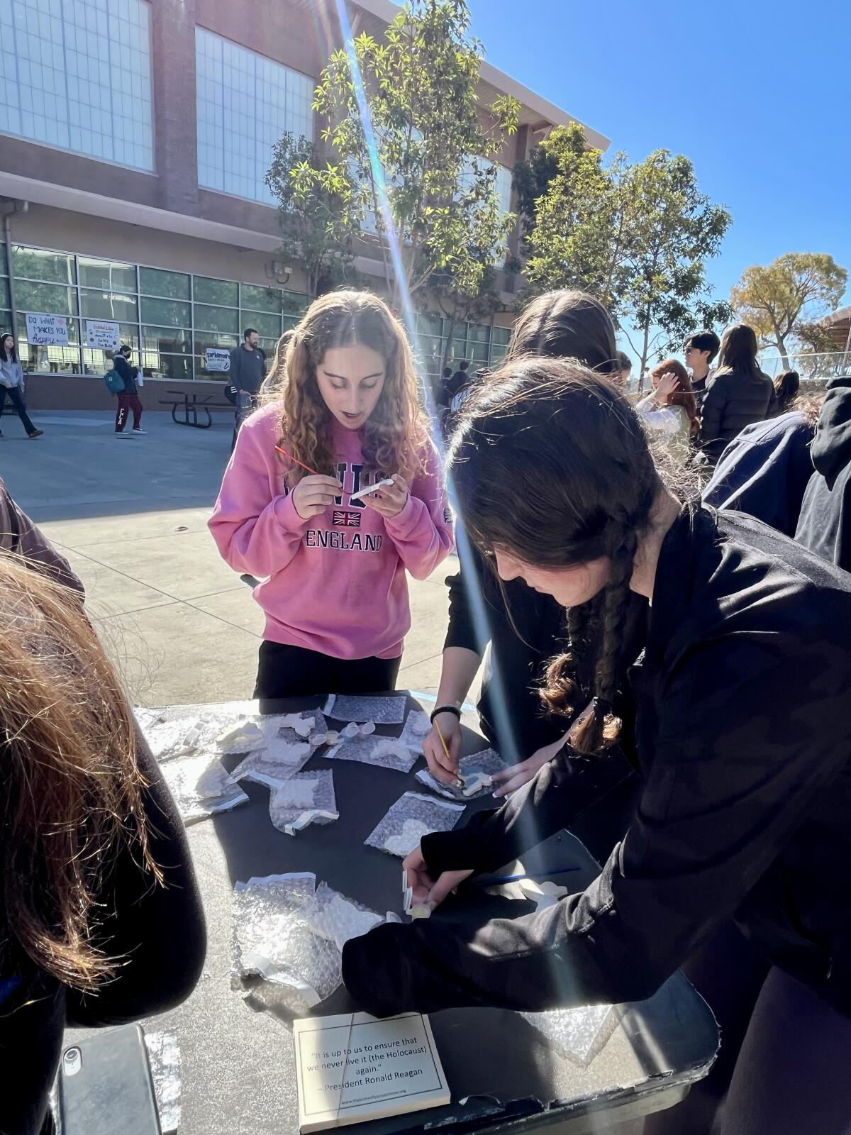 Students paint butterflies on Holocaust Memorial Day.