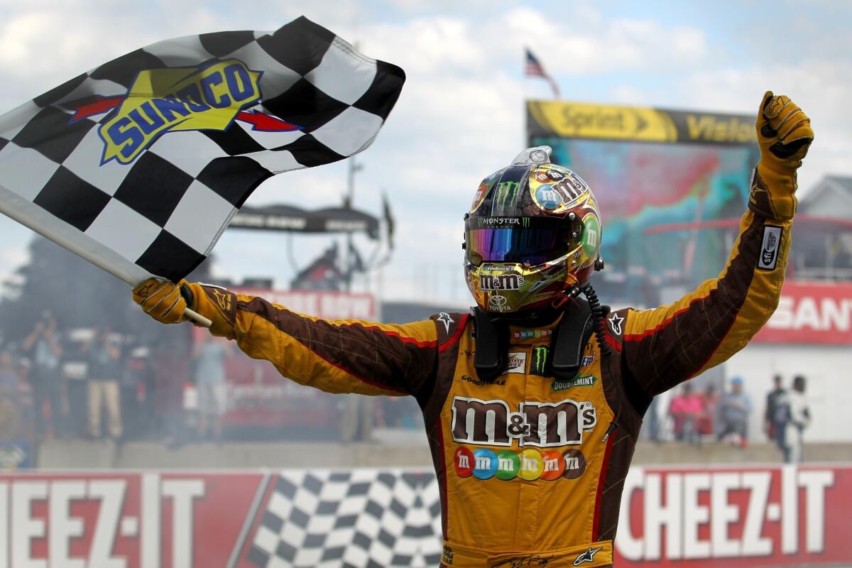 NASCAR driver Kyle Busch celebrates after winning the Sprint Cup Series race at Watkins Glen on Sunday.