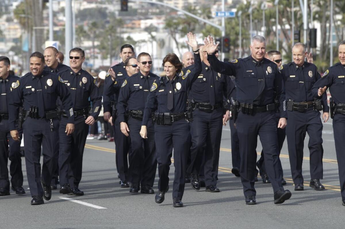 Senior ranking officers from the San Diego Police Department wave to the crowd during the city's annual Dr. Martin Luther King Parade