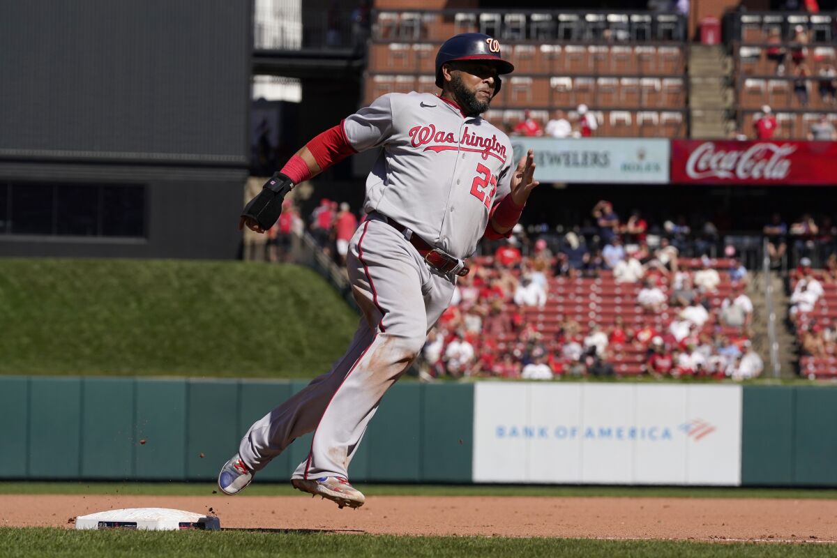 Nelson Cruz of the Washington Nationals scores against the St. Louis Cardinals on September 8, 2022.