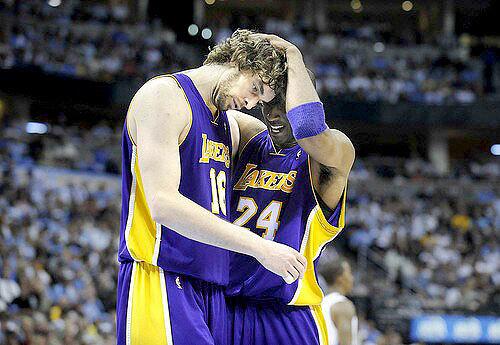 Kobe Bryant and Pau Gasol embrace as they put the finishing touches on the Denver Nuggets in Game 6 on Friday night.