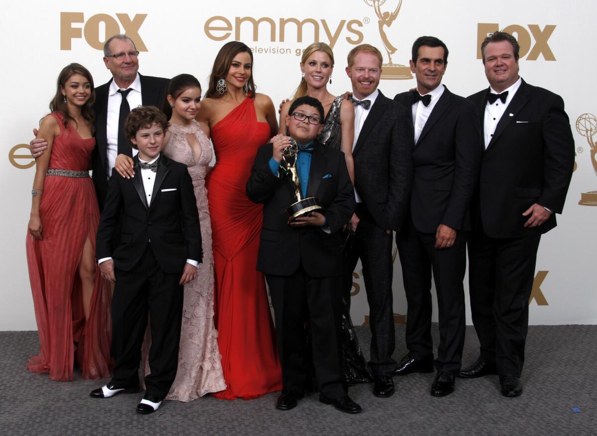 The "Modern Family" cast hoists one of its earliest Emmys.