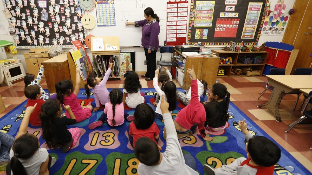 Teacher Celia Cendejas leads pre-K students at Dorris Place Elementary School in Los Angeles in 2015.