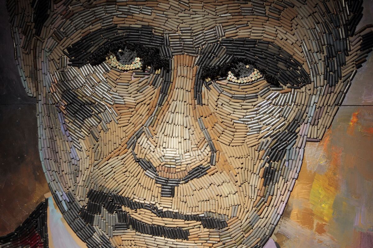 A portrait of Russian President Vladimir Putin made of weapons cartridges is seen in Kiev, Ukraine. 
