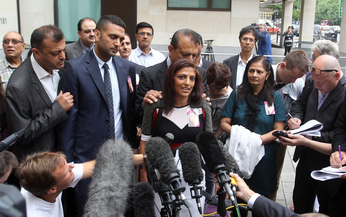 Surrounded by family members, Ami Denborg, sister of Anni Dewani, speaks to reporters outside Westminster Magistrates Court in London on Wednesday.