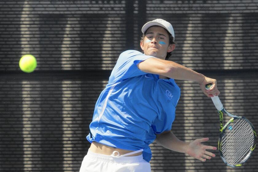 Corona del Mar High's Bjorn Hoffmann hits the ball during the first set against San Marino.