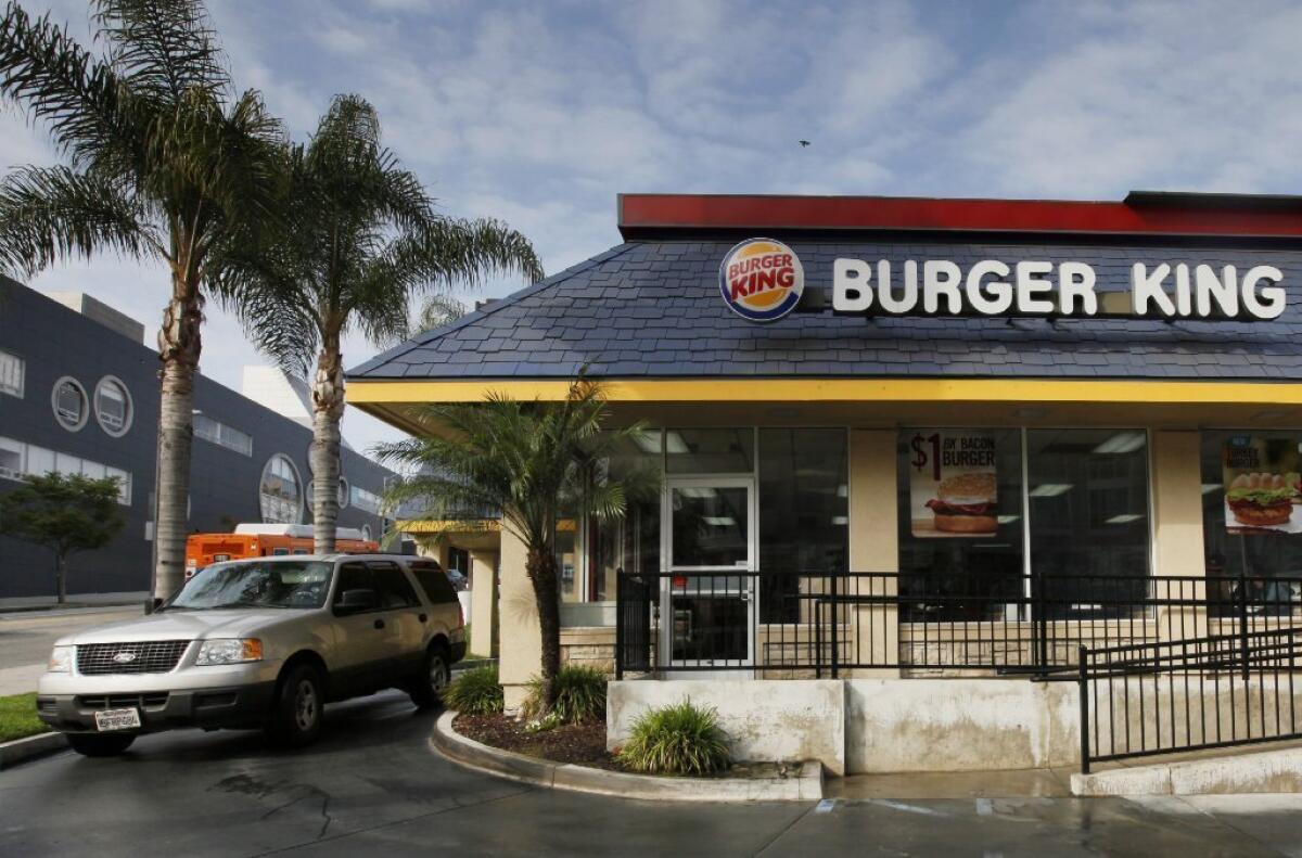 Burger King profits climbed in the fourth quarter of 2013 as the company moved toward a fully franchised business model.