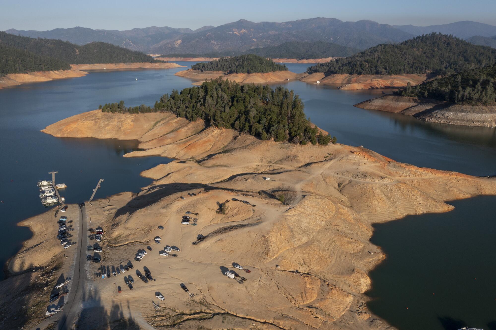 The receding shoreline at a boat ramp illustrates the worsening drought conditions on Lake Shasta.