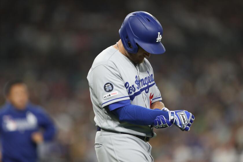 SAN DIEGO, CALIFORNIA - AUGUST 28: Max Muncy #13 of the Los Angeles Dodgers reacts after being hit by a pitch during the fifth inning of a game against the San Diego Padres at PETCO Park on August 28, 2019 in San Diego, California. Muncy left the game after being examined by trainers. (Photo by Sean M. Haffey/Getty Images) ** OUTS - ELSENT, FPG, CM - OUTS * NM, PH, VA if sourced by CT, LA or MoD **