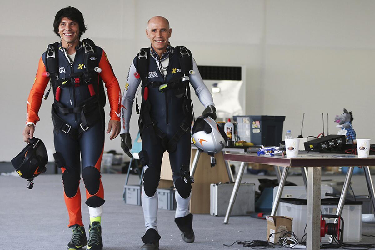 Vincent Reffet, left, and Yves Rossy gear up in 2015.