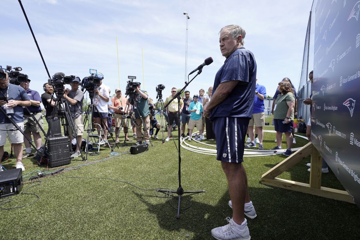 New England Patriots head coach Bill Belichick faces reporters before an NFL football team practice, Tuesday, June 7, 2022, in Foxborough, Mass. (AP Photo/Steven Senne)