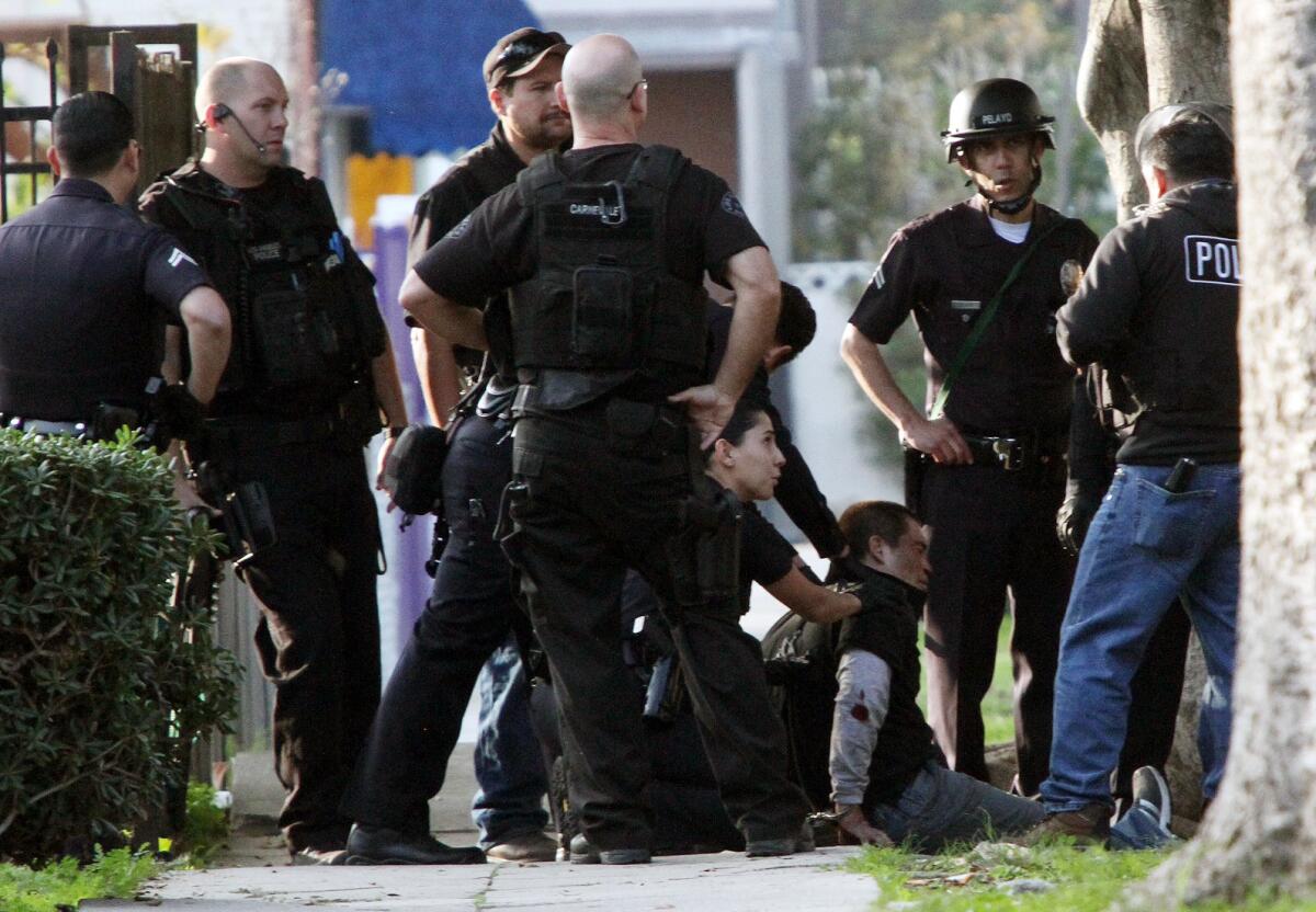 LAPD officers apprehended a suspect near the 2200 block of West Washington Boulevard in the Harvard Heights area of Los Angeles on Thursday morning.