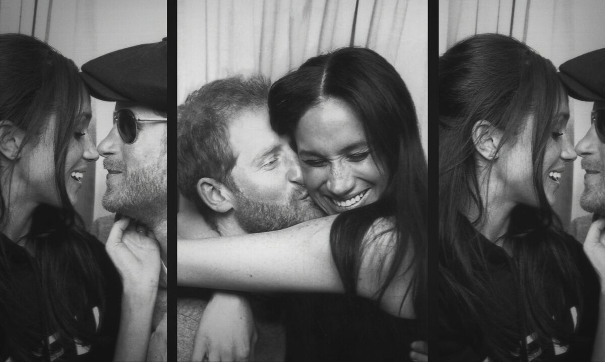 This image released by Netflix shows Prince Harry and Meghan, Duke and Duchess of Sussex, in a scene from the upcoming documentary "Harry & Meghan," directed by Liz Garbus. (Netflix via AP)