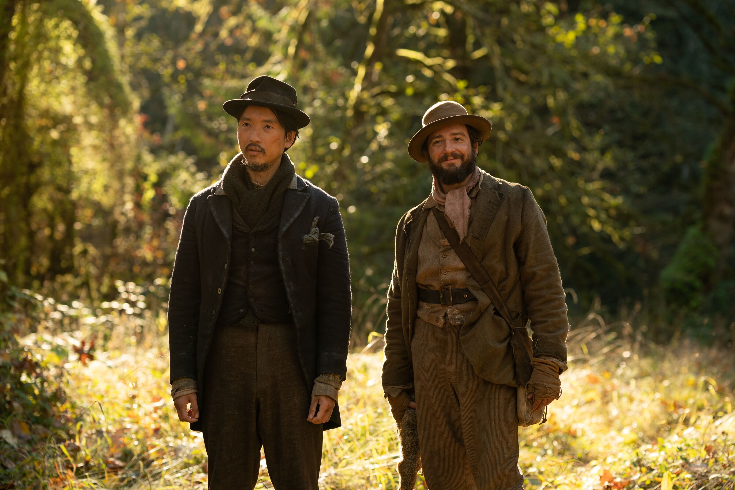 Orion Lee, left, and John Magaro in the film "First Cow."